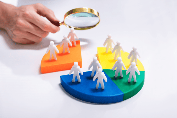 Business people looking at market segment