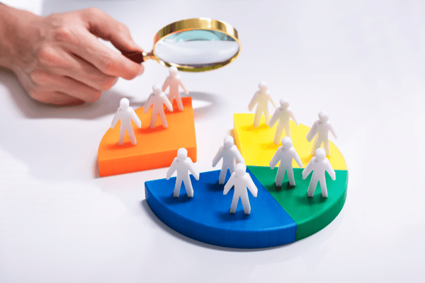 Business people looking at market segment