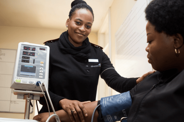 A woman getting her blood pressure tested