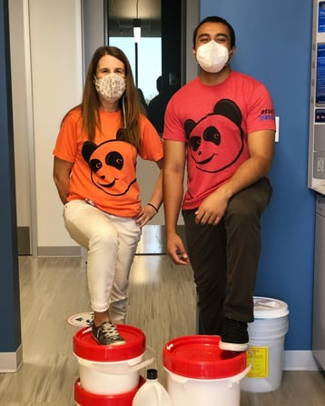 Two people in orange panda shirts