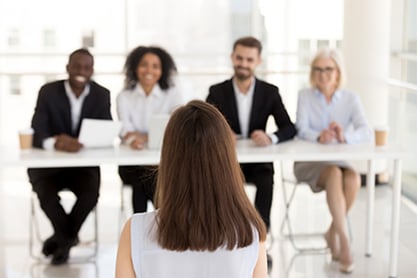Woman in front of panel