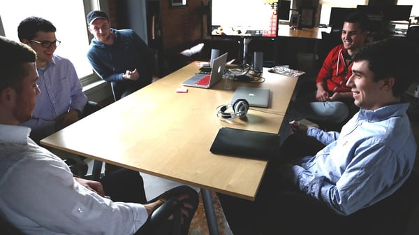 Startup sitting around the table giving feedback