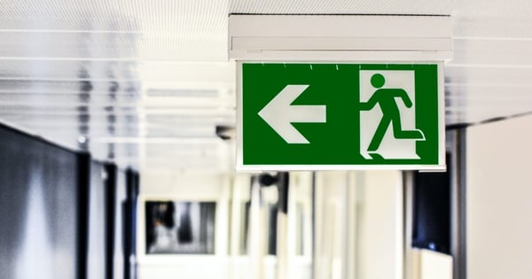 green and white sign emergency exit