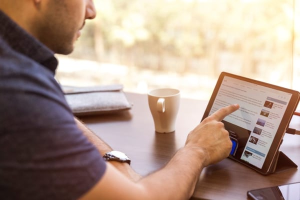 business model for startup companies man on ipad linkedin
