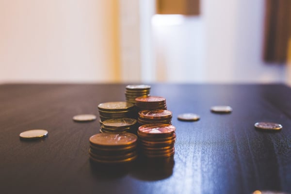 pile of brown coins on brown table