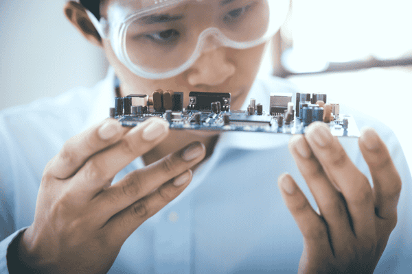 Technician Checking Electronic Device