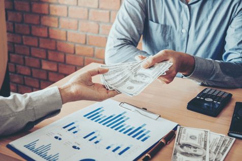 handing money to someone money transaction business deal stock photo