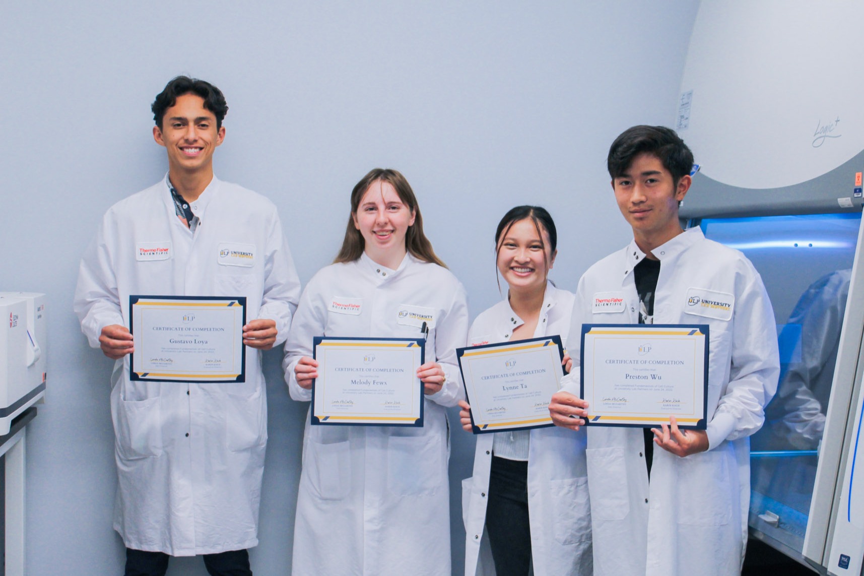 Group of students showing their certifications for the Principles of Flow Cytometry course