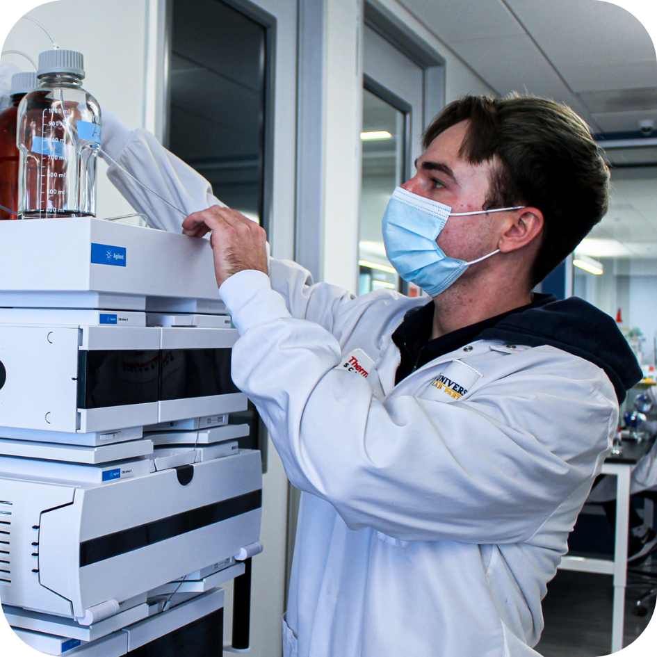 Student using laboratory equipment to learn HPLC methods